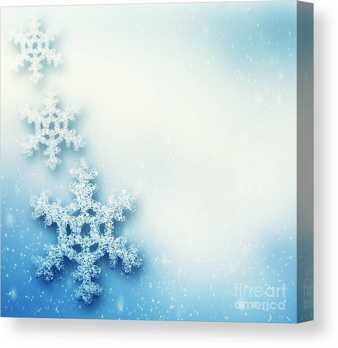 Snowflake Canvas Print featuring the photograph Winter Christmas background with big snowflakes by Michal Bednarek