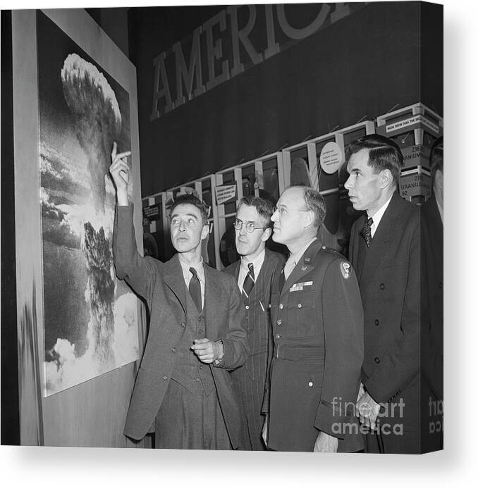 People Canvas Print featuring the photograph Robert Oppenheimer Pointing To Picture by Bettmann