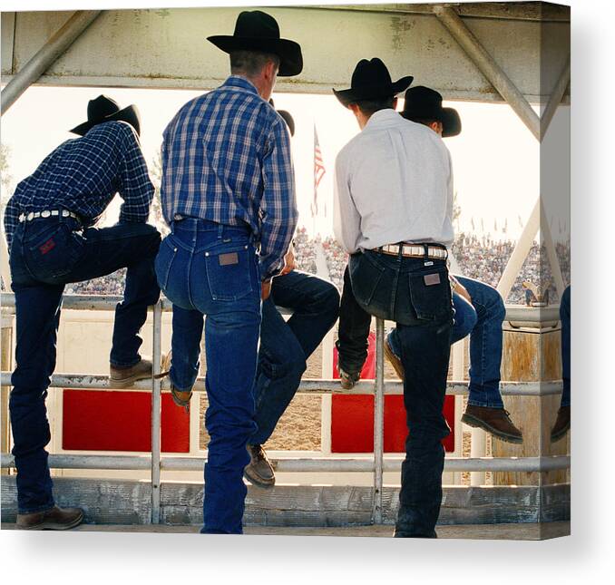 Plaid Shirt Canvas Print featuring the photograph Cowboys Watching Rodeo Arena, Rear View by Reza Estakhrian
