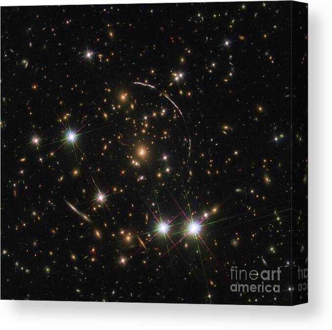 Galaxy Canvas Print featuring the photograph Gravitational Lensing Of A Galaxy by Esa/hubble, Nasa, Rivera-thorsen Et Al/science Photo Library