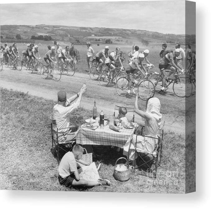 Child Canvas Print featuring the photograph Picnicking Family Greets Tour De France by Bettmann