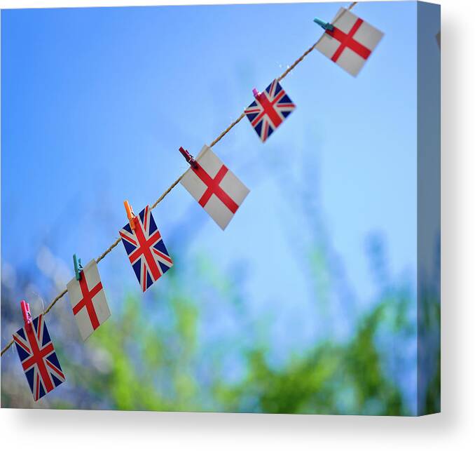 Hanging Canvas Print featuring the photograph Uk And English Flags On Rope Line by Alexandre Fp