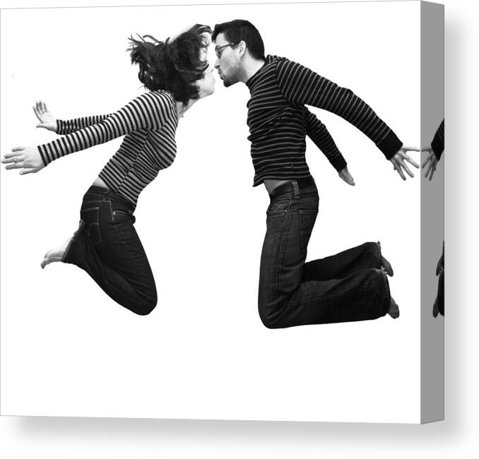 Young Men Canvas Print featuring the photograph The flying kiss by by Ludovic Toinel