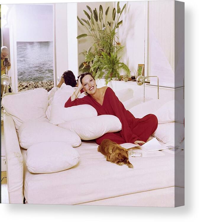 Dog Canvas Print featuring the photograph Elsa Peretti Wearing Halston Pajamas by Horst P. Horst