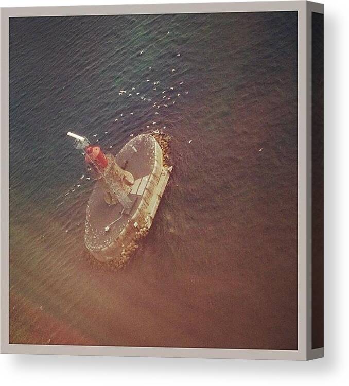  Canvas Print featuring the photograph A Light House Island As We Descend by Srini Swaminathan