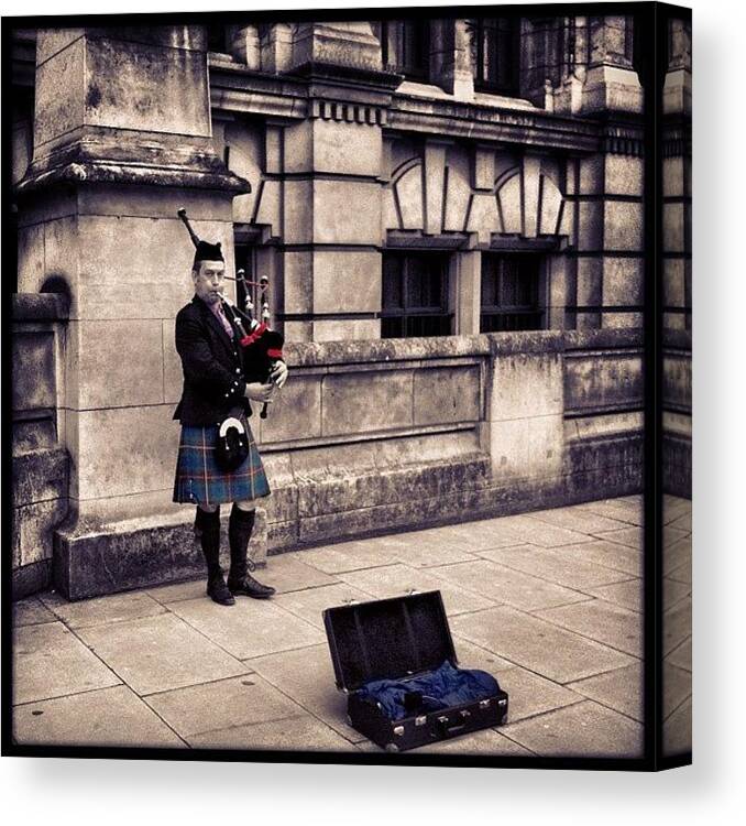 Scotsman Canvas Print featuring the photograph A Lone Piper Piping

#piper #bagpipes by Dan Warwick