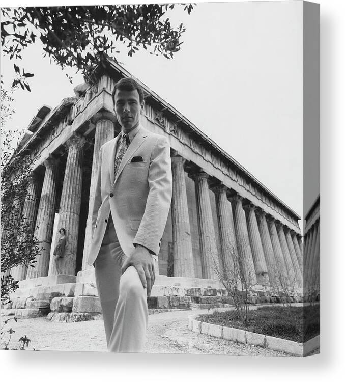Fashion Canvas Print featuring the photograph A Male Model Posing In Front Of The Theseion by Leonard Nones