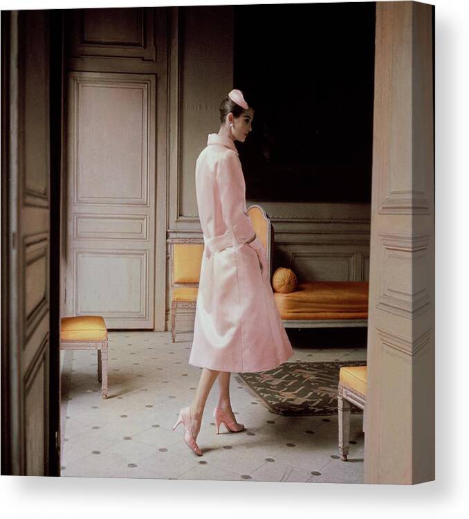 Fashion Canvas Print featuring the photograph A Model Wearing A Pink Coat by Karen Radkai