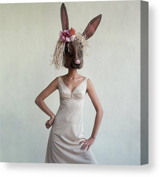 Fashion Canvas Print featuring the photograph A Woman Wearing A Rabbit Mask by Gianni Penati