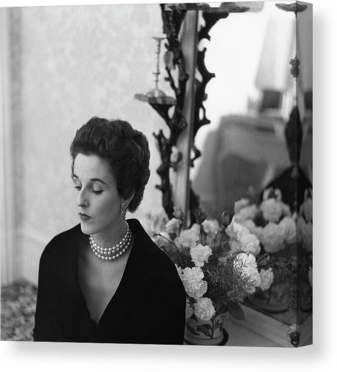 One Person Canvas Print featuring the photograph Babe Paley Looking Elegant In A Pearl Necklace by Frances McLaughlin-Gill