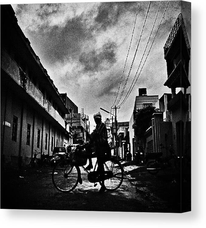 Monochromatic Canvas Print featuring the photograph #bicycle #monsoon #rain #lookup #clouds by Vinit Jain