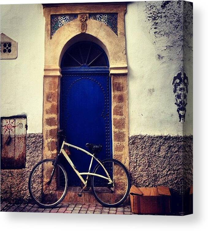 Morocco Canvas Print featuring the photograph Bikes And Doorways. It's Universal by Sarah Dawson