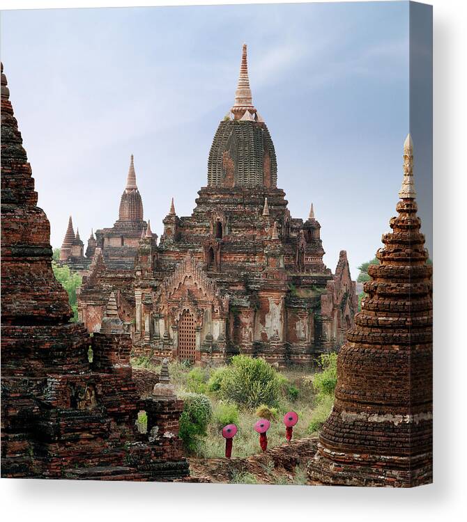 Tranquility Canvas Print featuring the photograph Buddhist Monks Walking Past Temple by Martin Puddy