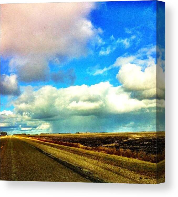 Canada Canvas Print featuring the photograph Far Away Storm #storm #driving #clouds by Kelsey Parisien