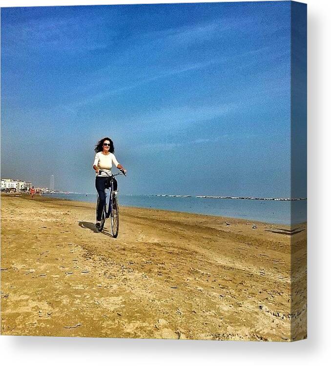 Riding Canvas Print featuring the photograph Riding on the beach by Maria Grazia Casella