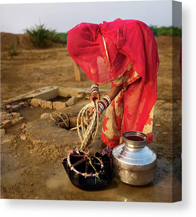Working Canvas Print featuring the photograph Indian Woman Getting Water From The by Hadynyah