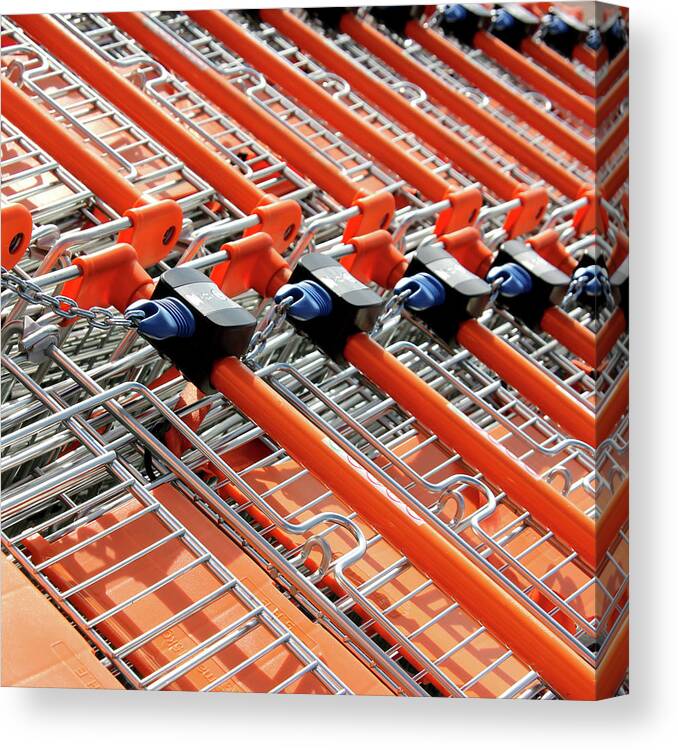 Orange Color Canvas Print featuring the photograph Retail Shopping Trolleys by Andrea Kennard Photography