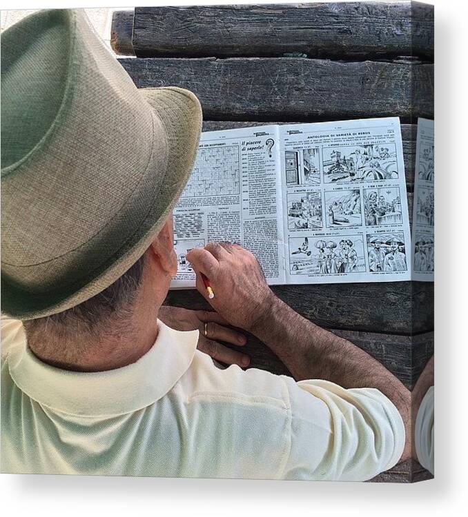 Iphoneonly Canvas Print featuring the photograph Retired Man With Crosswords by Adriano La Naia