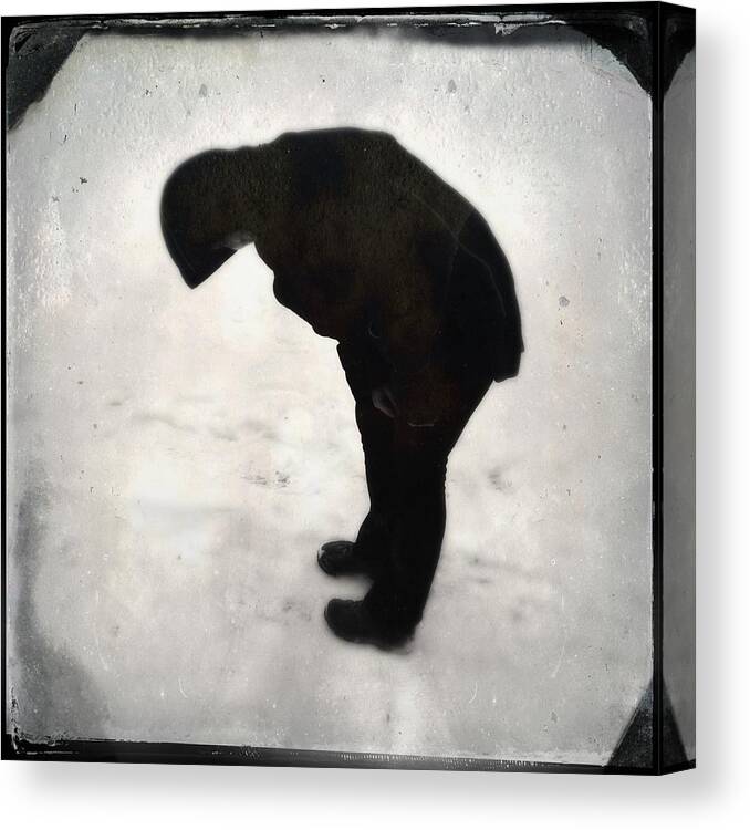 Silhouette Canvas Print featuring the photograph Surreal silhouette of a person in the snow by Matthias Hauser