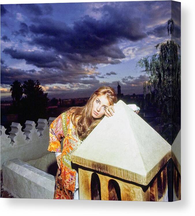 Marrakesh Canvas Print featuring the photograph Talitha Getty Leaning On Lantern At Sunset by Patrick Lichfield