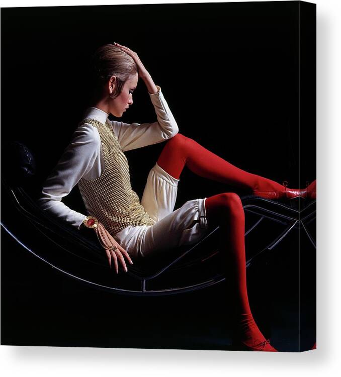 Accessories Canvas Print featuring the photograph Twiggy Sitting On A Modern Chair by Bert Stern
