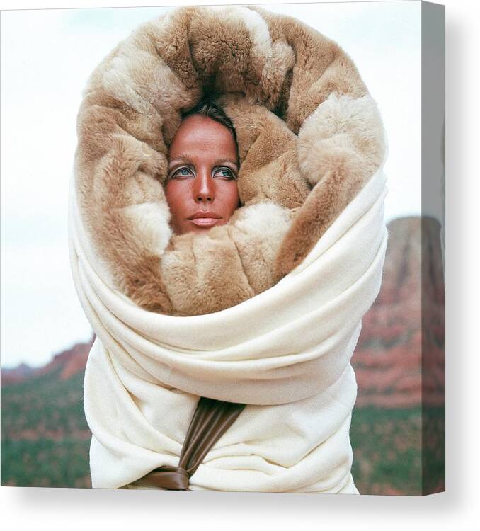 Fashion Canvas Print featuring the photograph Veruschka Von Lehndorff Wearing A Fur Wrap by Franco Rubartelli