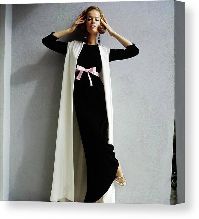 1960s Style Canvas Print featuring the photograph Veruschka Wearing A White Coat by Bert Stern