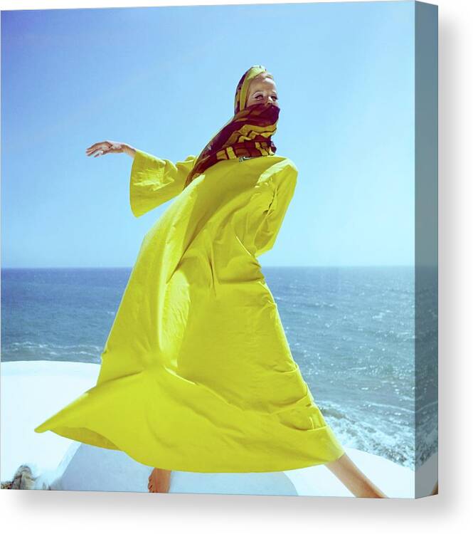 Accessories Canvas Print featuring the photograph Veruschka Wearing A Yellow Kaftan by Henry Clarke
