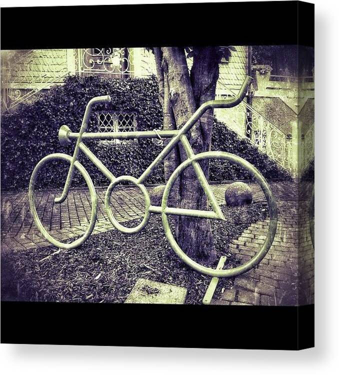 Steel Canvas Print featuring the photograph A Bicycle statue In The City Made by Sascha Buchholz