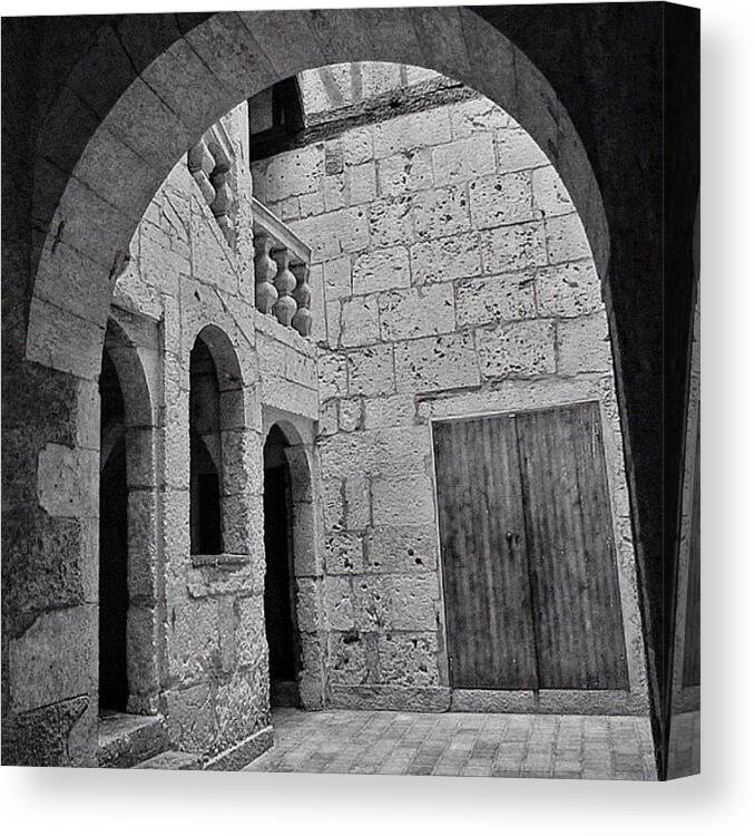 Stones Canvas Print featuring the photograph #arch #door #stones #courtyard #history by Val Lao