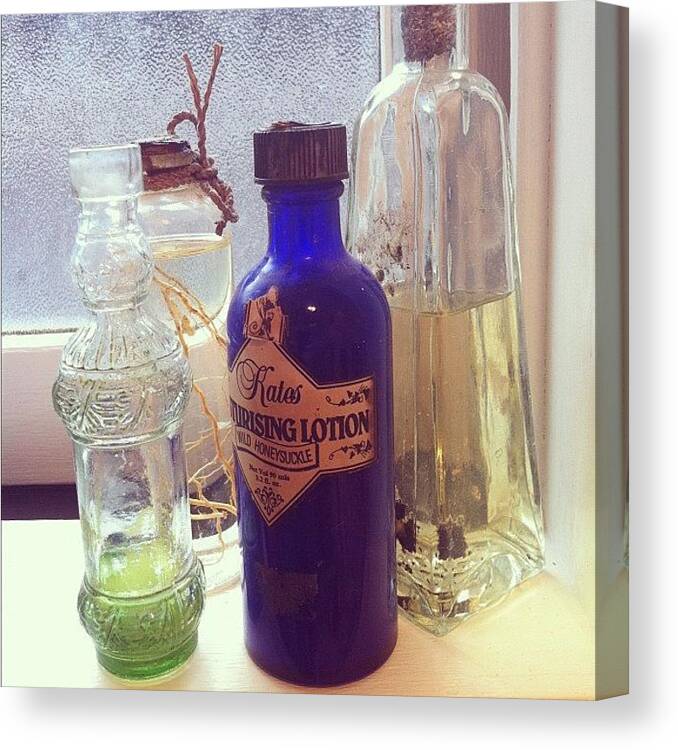 Bottles Canvas Print featuring the photograph Bottles by Rhiannon Lea