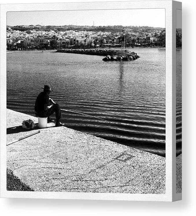  Canvas Print featuring the photograph Fisherman by Spyros Papaspyropoulos