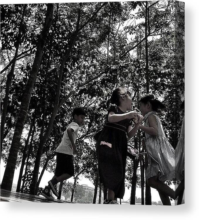 Blackandwhite Canvas Print featuring the photograph #kids #prancing #trees #nature #shadows by Kokky Lawrence