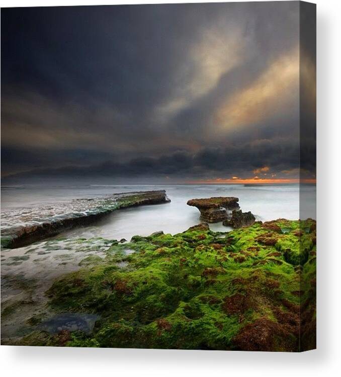  Canvas Print featuring the photograph Long Exposure Of A Stormy Sunset At A by Larry Marshall
