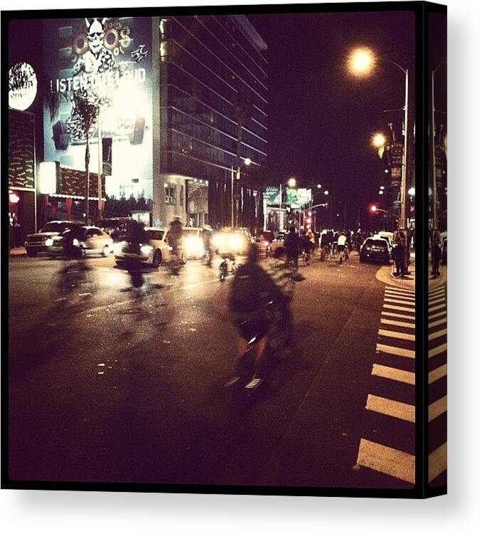  Canvas Print featuring the photograph Police Escorted Bike Ride Down Sunset by Max Jolliffe