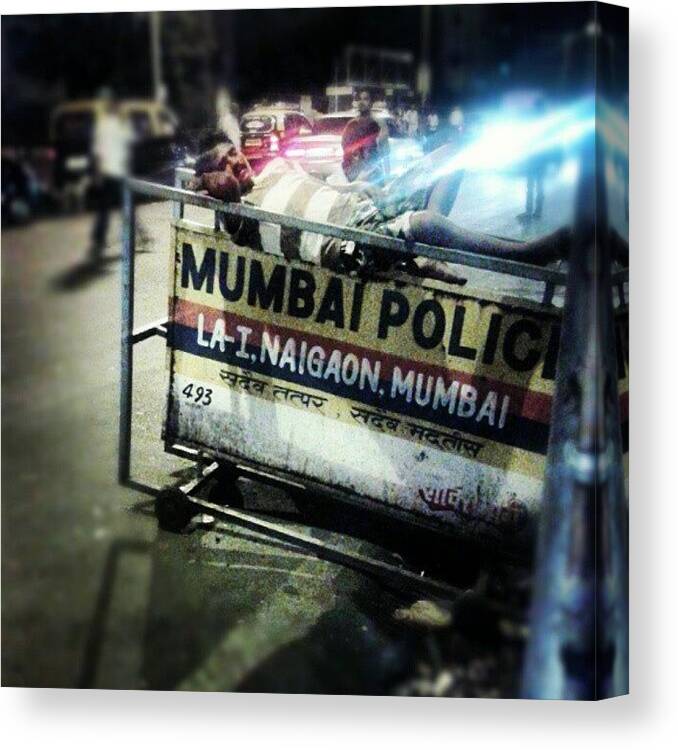  Canvas Print featuring the photograph Sleeping With The Police! by Nikhil Idicula