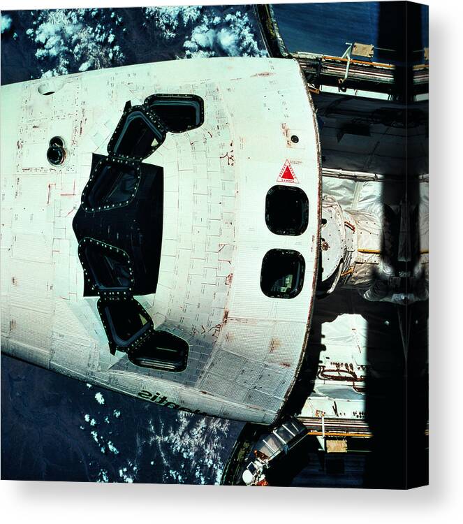 Square Canvas Print featuring the photograph The Space Shuttle Orbiting Above The Earth by Stockbyte