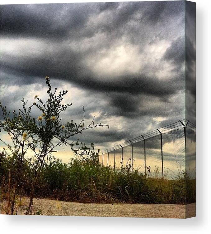  Canvas Print featuring the photograph Under A Dark Stormy Sky by Brett Stoddart