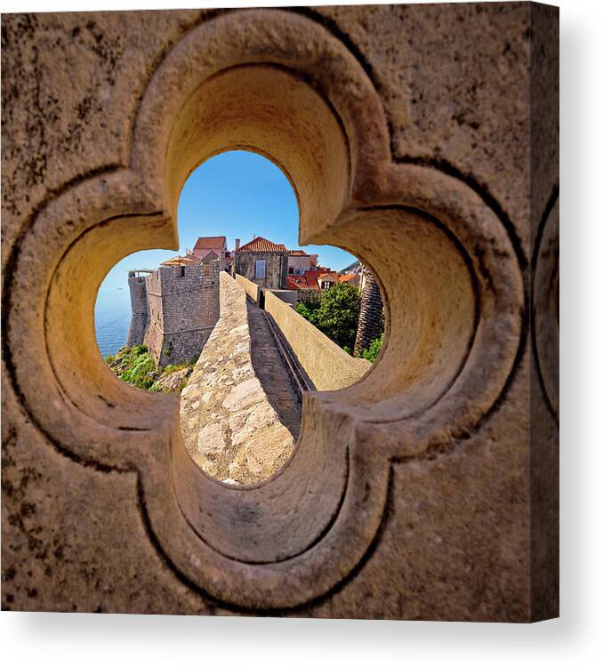 Dubrovnik Canvas Print featuring the photograph Dubrovnik city walls view through stone carved detail by Brch Photography