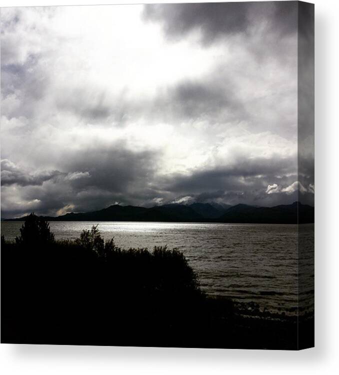Travel Canvas Print featuring the photograph Fading Light Over A Huge Lake In by Dante Harker