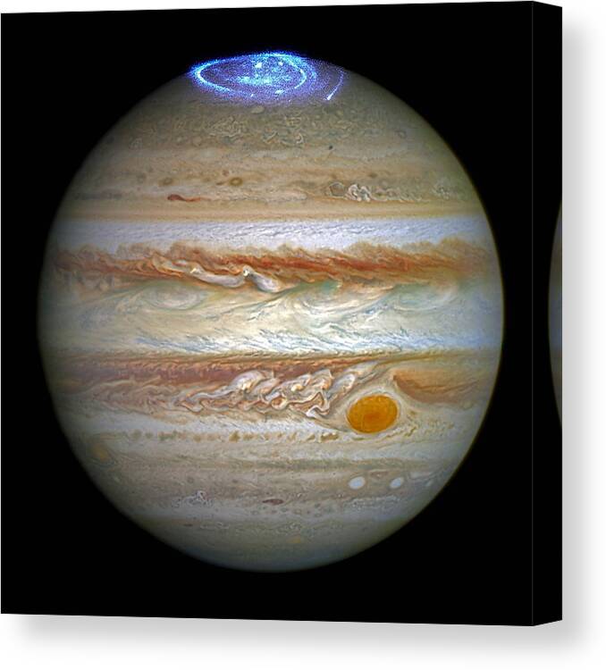 Jupiter Canvas Print featuring the photograph Hubble Captures Vivid Auroras in Jupiter's Atmosphere by Eric Glaser