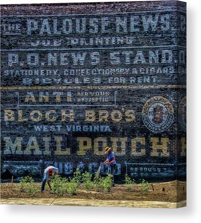 Palouse News Canvas Print featuring the photograph Palouse News Painted Sign on Brick by Ed Broberg