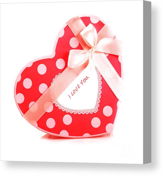 Affection Canvas Print featuring the photograph Red heart-shaped gift box by Anna Om