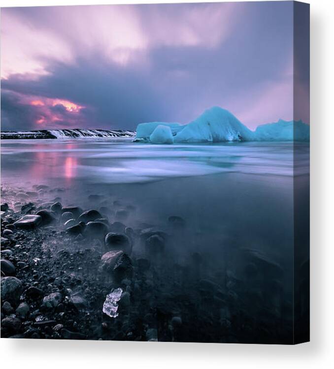 Clouds Canvas Print featuring the photograph Sunset at the Glacier Lagoon - Iceland - Seascape photography by Giuseppe Milo