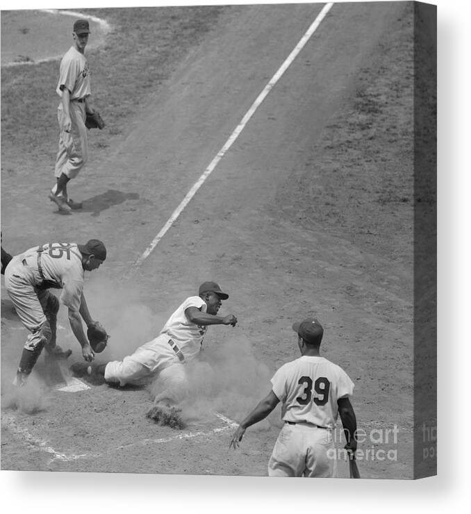 Second Inning Canvas Print featuring the photograph Baseball Player Jackie Robinson Sliding by Bettmann