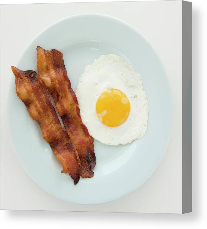 Unhealthy Eating Canvas Print featuring the photograph Close Up Of Fried Egg With Bacon by Jamie Grill