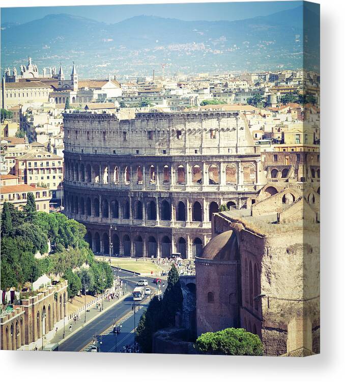 Dawn Canvas Print featuring the photograph Coliseum In Rome by Gianlucabartoli