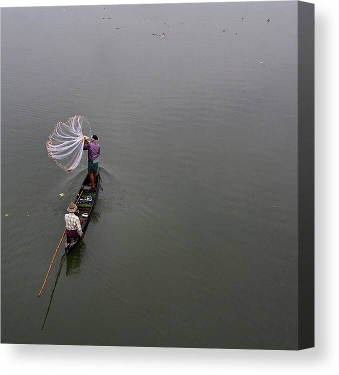Tranquility Canvas Print featuring the photograph Fisherman Throwing Net by Vinod Kumar Photography