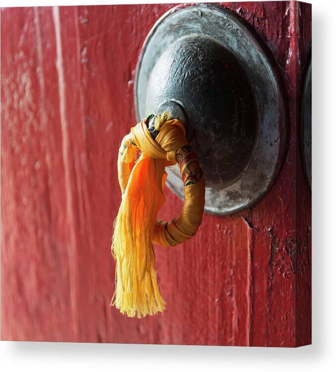 Chinese Culture Canvas Print featuring the photograph Gold Tassel Tied To A Doorknob On A Red by Keith Levit / Design Pics