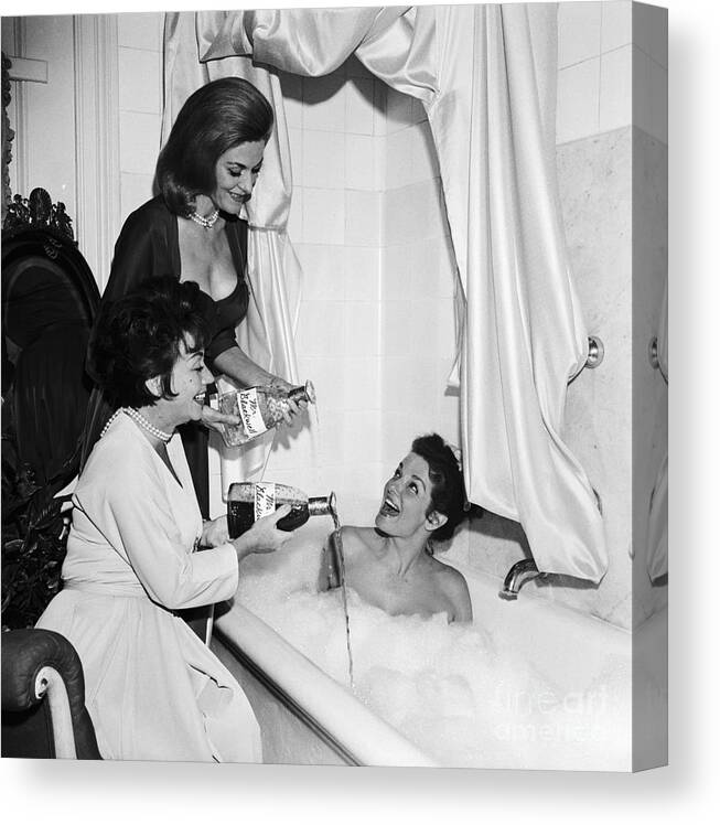 People Canvas Print featuring the photograph Jane Russell Bathes In Perfume by Bettmann